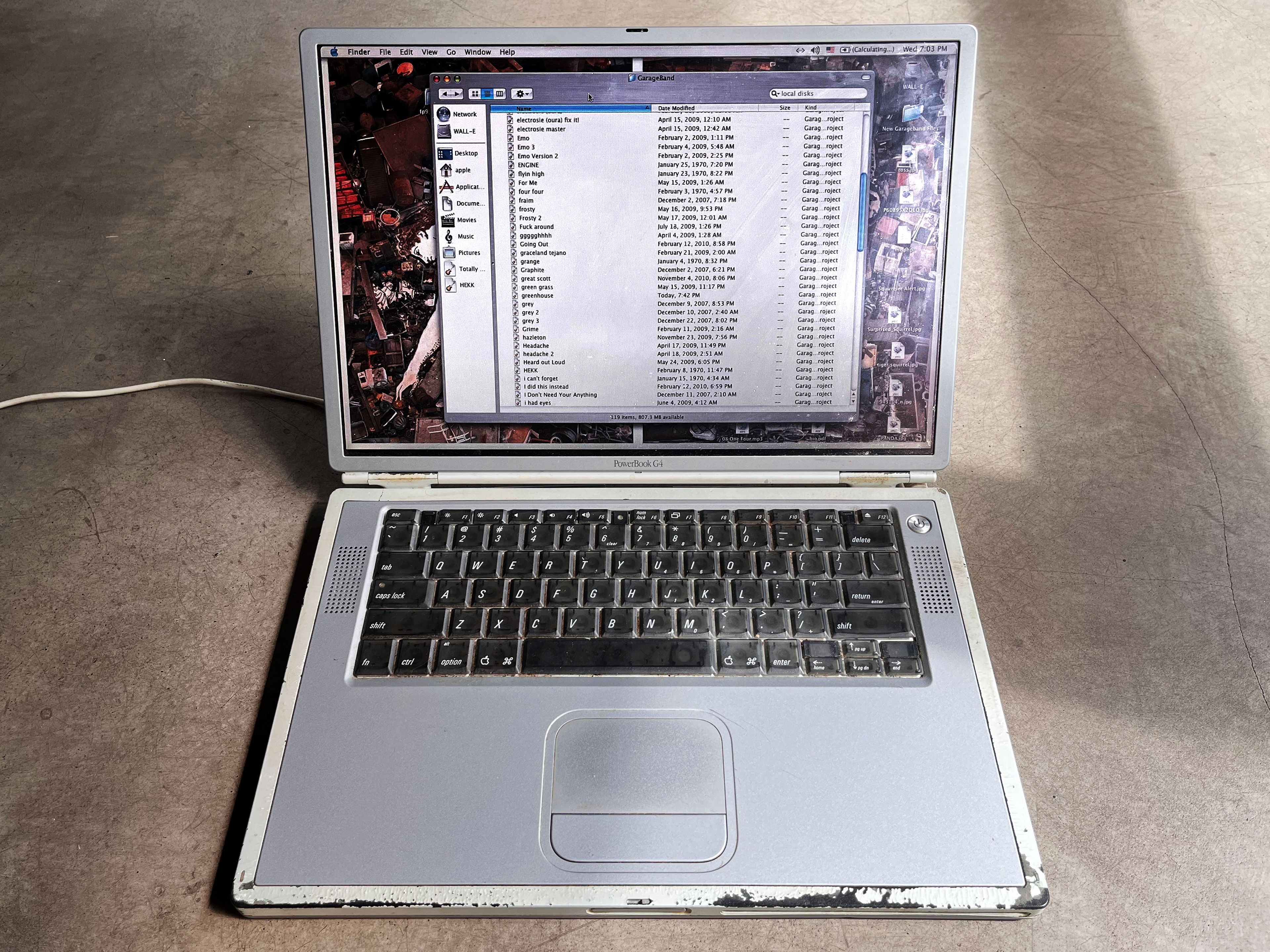 PowerBook G4 laptop with file directories shown